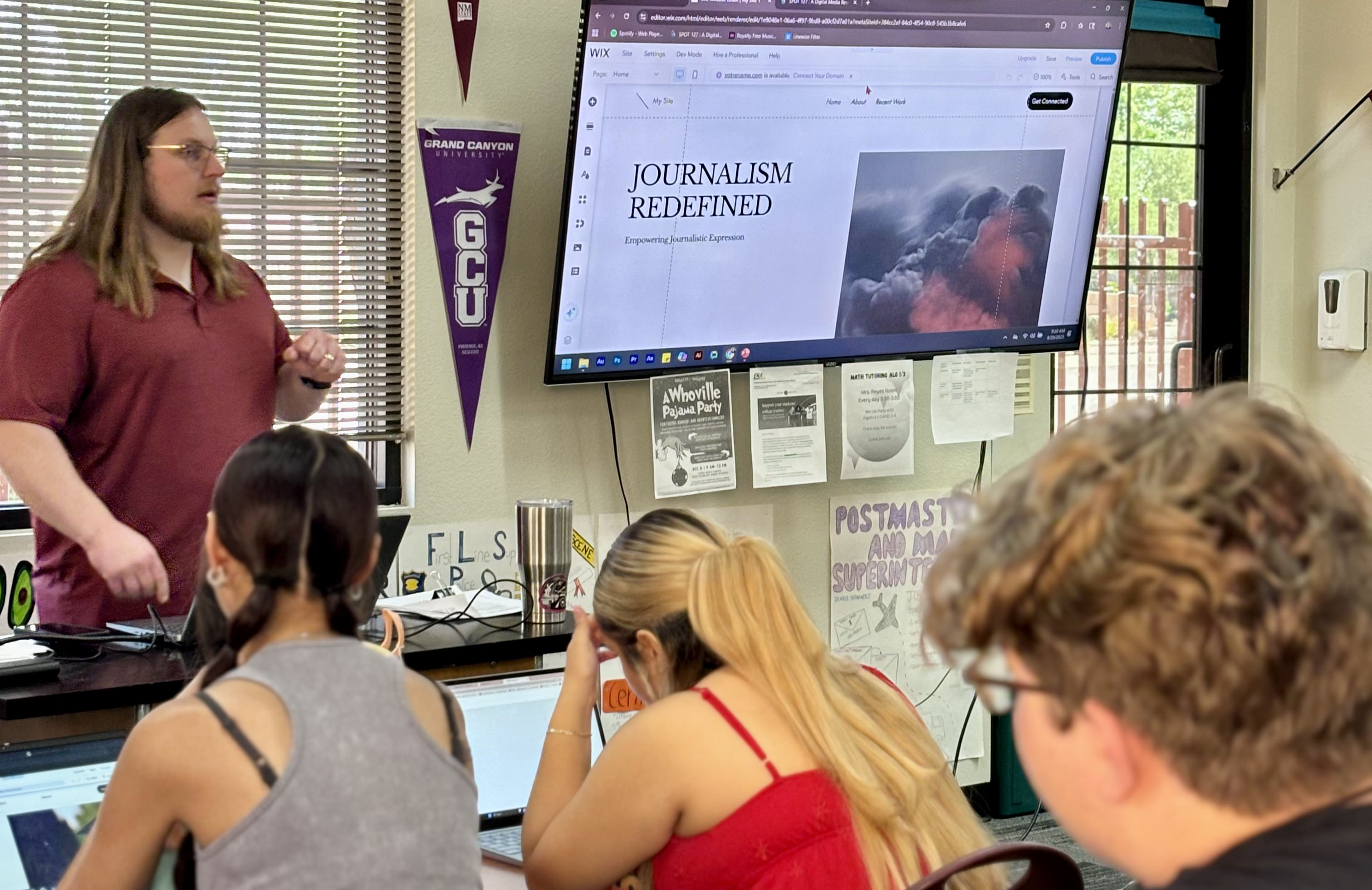 SPOT 127 instructor speaking in front of a classroom of students.