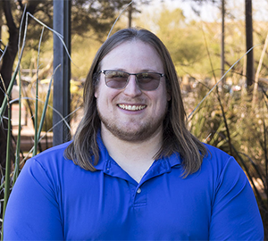 SPOT 127 Lead Instructional Facilitator Jakob Rosales-Wastek outdoors and smiling