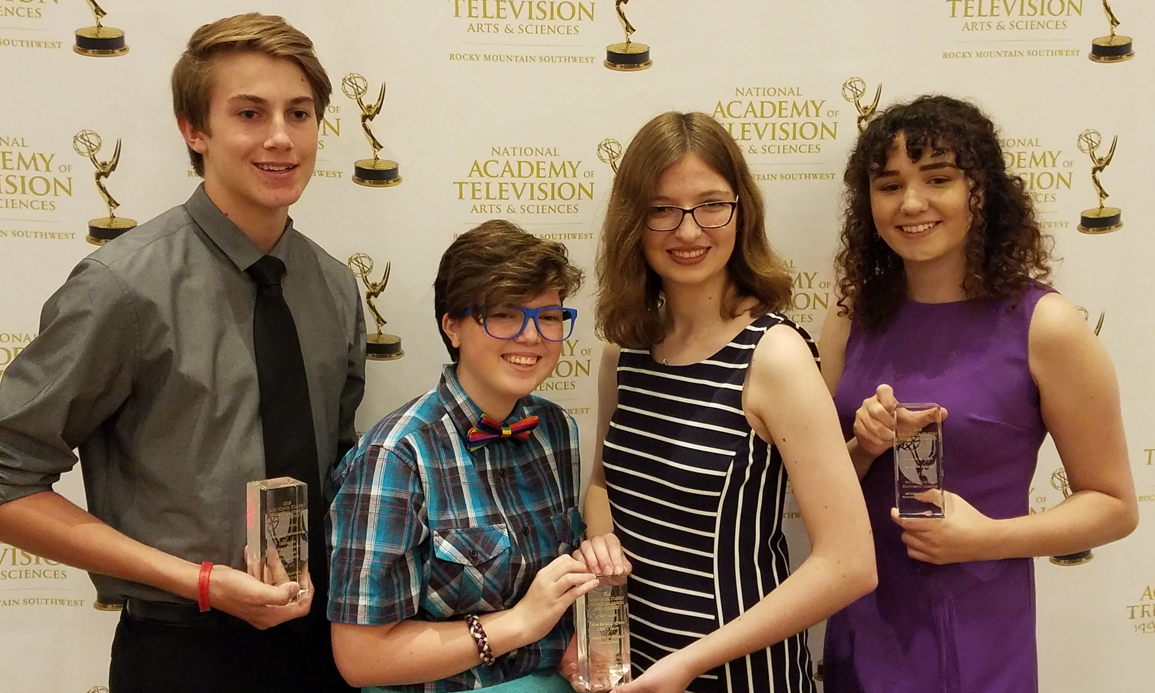 Four SPOT students happily posing with their awards at the NATAS Emmy Awards.